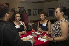 Three black women smiling