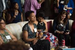 A group of Women sitting at an event