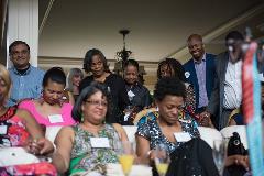 A group of people praying at an event